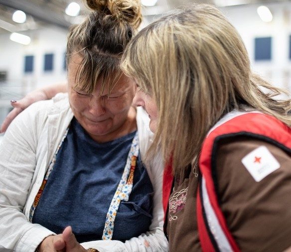 A Red Cross volunteer at a disaster relief operation
