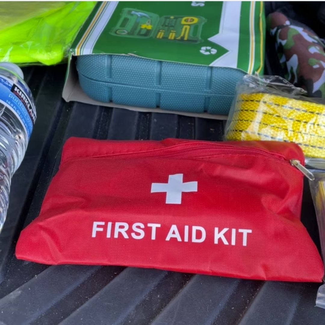red cross first aid kit in car trunk