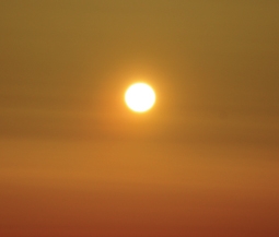 sun shown through hazy clouds